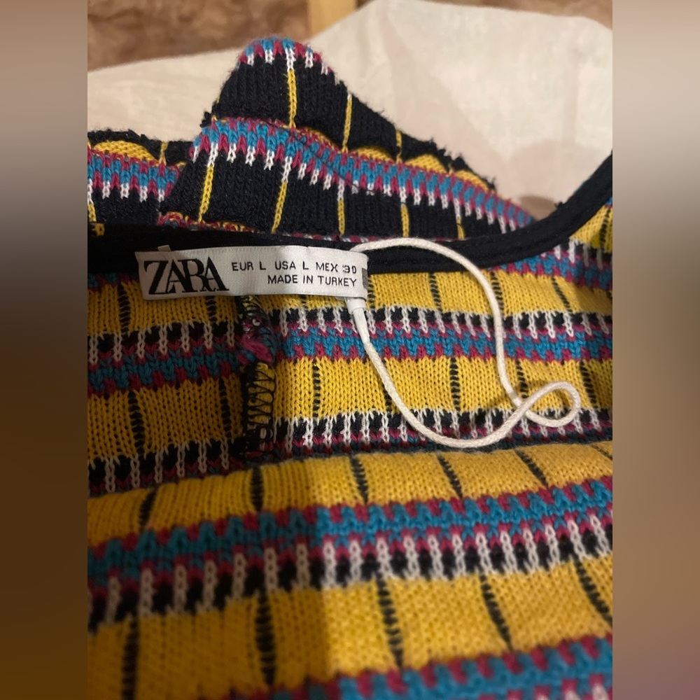 Beautiful Zara romper with multiple colors ..